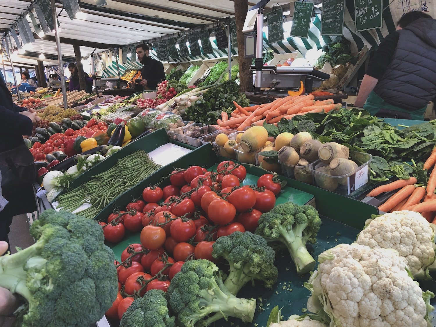 Tomatoes, broccoli, green beans, vegatables at a French market